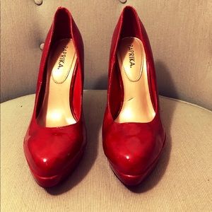 Red paten leather pumps